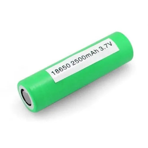 a green remote control sitting on a table