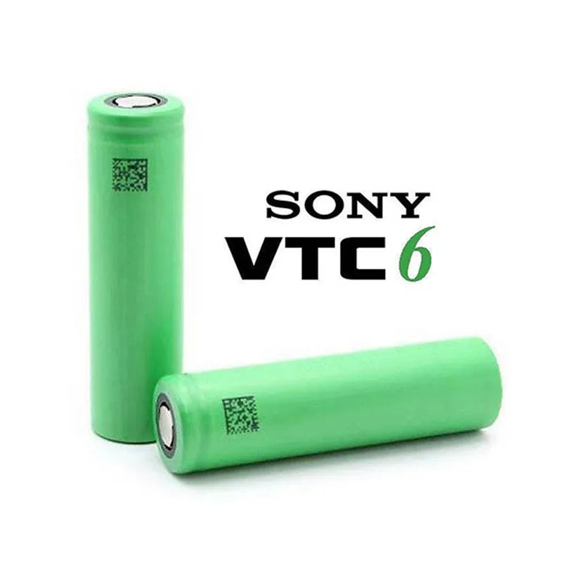 a green cell phone sitting next to a green toothbrush